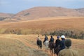 Group of Indian Horse riding riders on a trail in Drakensberg region in South Africa Royalty Free Stock Photo