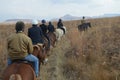 Group of Indian Horse riding riders on a trail in Drakensberg region in South Africa Royalty Free Stock Photo