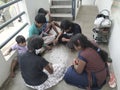 Group of Indian Kids Playing Chowka bhara or Ludo Board Game in front of the House Royalty Free Stock Photo