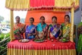 Group of Indian ladies smiling and posing for a photo at wedding