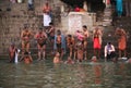 A group of indian men washing before ganges Royalty Free Stock Photo