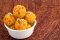 Group Of Indian Mithai Jodhpuri Ladoo Laddu Also Called Boondi Or Bundi Ladoo Decorated In White Bowl. Meetha Laddoo Deep Fried In