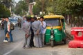 group of Indian taxi drivers communicate with each other.