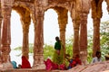 Jodhpur, India - August 20, 2009: group of Indian women and men rest under a patio near the fort of Jodhpur, India Royalty Free Stock Photo