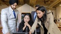 Group of Indian workers brainstorming during a business meeting in office