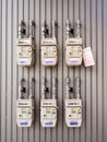 Group of individual residential natural gas meters on building Royalty Free Stock Photo