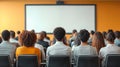Corporate seminar with attendees seated in conference room focusing on presentation Royalty Free Stock Photo