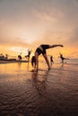 a group of Indonesian women doing gymnastic exercises very agile on the beach Royalty Free Stock Photo