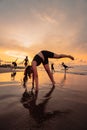 a group of Indonesian women doing gymnastic exercises very agile on the beach Royalty Free Stock Photo