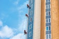 Group of industrial climber work on a modern building outdoor Royalty Free Stock Photo