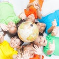 Group of international funny kids with globe earth Royalty Free Stock Photo