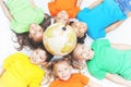 Group of international kids holding globe earth Royalty Free Stock Photo