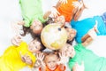 Group of international kids holding globe earth Royalty Free Stock Photo