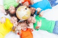 Group of international kids holding globe earth Royalty Free Stock Photo