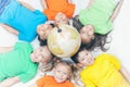 Group of international kids holding globe earth Royalty Free Stock Photo