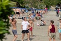 A group of international students from all over the world playing sand volleyball on the beach of bacvice in split. Many different