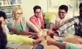 Group of international students making fist bump Royalty Free Stock Photo