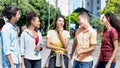 Group of international young adults in discussion in city Royalty Free Stock Photo