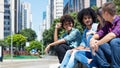 Group of international young adults talking in the city Royalty Free Stock Photo