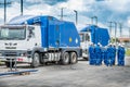 Group of interns at Schlumberger Wireline field training next to two wireline trucks Royalty Free Stock Photo