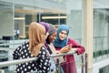 Group of islamic women of different ethnicity watching on the phone together Royalty Free Stock Photo