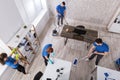 Group Of Janitors Cleaning The Office Royalty Free Stock Photo