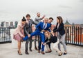 A group of joyful businesspeople having a party outdoors on roof terrace in city. Royalty Free Stock Photo