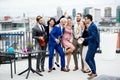 A group of joyful businesspeople having a party outdoors on roof terrace in city. Royalty Free Stock Photo