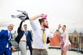 A group of joyful businesspeople having a party outdoors on roof terrace in city. Royalty Free Stock Photo