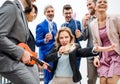 A group of joyful businesspeople having a party outdoors on roof terrace in city. Royalty Free Stock Photo