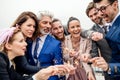 A group of joyful businesspeople having a party outdoors on roof terrace in city. Royalty Free Stock Photo