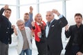 Group of joyful excited business people having fun in office Royalty Free Stock Photo