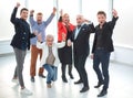 Group of joyful excited business people having fun in office Royalty Free Stock Photo