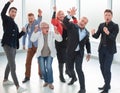 Group of joyful excited business people having fun in office Royalty Free Stock Photo