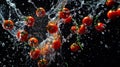 A group of juicy cherry tomatoes falls into the clear transparent spring water, creating a bunch of bubbles, splashes of drops. A Royalty Free Stock Photo