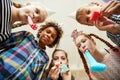 Group of Kids Blowing Party Horns