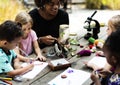 Group of kids classmates learning biology drawing class