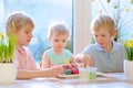 Group of kids decorating Easter eggs Royalty Free Stock Photo