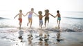 Group of kids enjoying their time at the beach Royalty Free Stock Photo