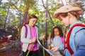 Three little kids reading orientation map