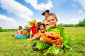 Group of kids in Halloween costumes sitting Royalty Free Stock Photo