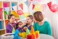 Group of kids having fun at birthday party Royalty Free Stock Photo