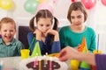 Group of kids having fun at birthday party Royalty Free Stock Photo