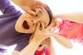 Group of kids having fun and making faces outdoors Royalty Free Stock Photo