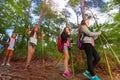 Group of kids on hiking trail walking in forest Royalty Free Stock Photo