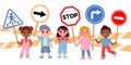 Group of kids holding stop road signs, caution for drivers. Boy and girl with traffic symbols. Children street safety