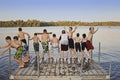 Group of kids jumping into Lake Royalty Free Stock Photo