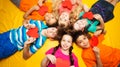 Group of kids laying with red hearts Royalty Free Stock Photo