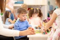 Group of kids on lesson in kindergarten