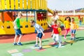 Group of kids play hopscotch